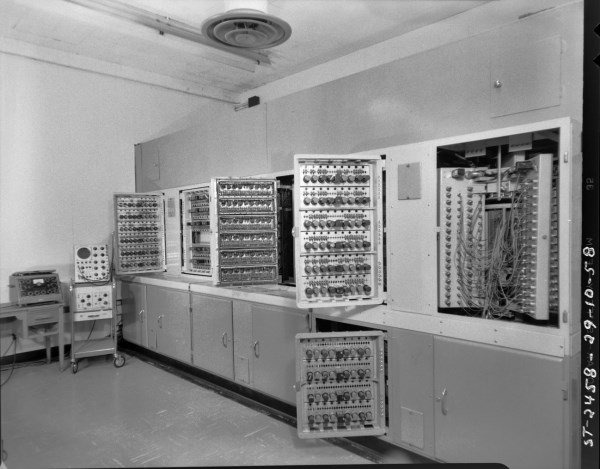 This was the area between the two equiment bays.The open doors provide a good shot of just some of the 4600 tubes that heated up the room when running. The open area to the right is the magnetic drum memory unit. Also shown are the trusty Tektronix 545 oscilloscope and a well-used AVO tube tester. Photo courtesy of the NRC Archives.